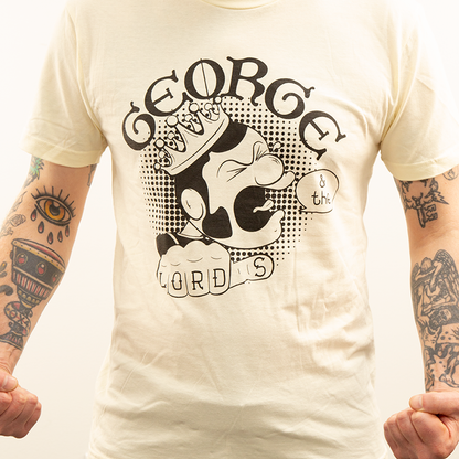 Tattooed guy wearing a George & the Lords t-shirt